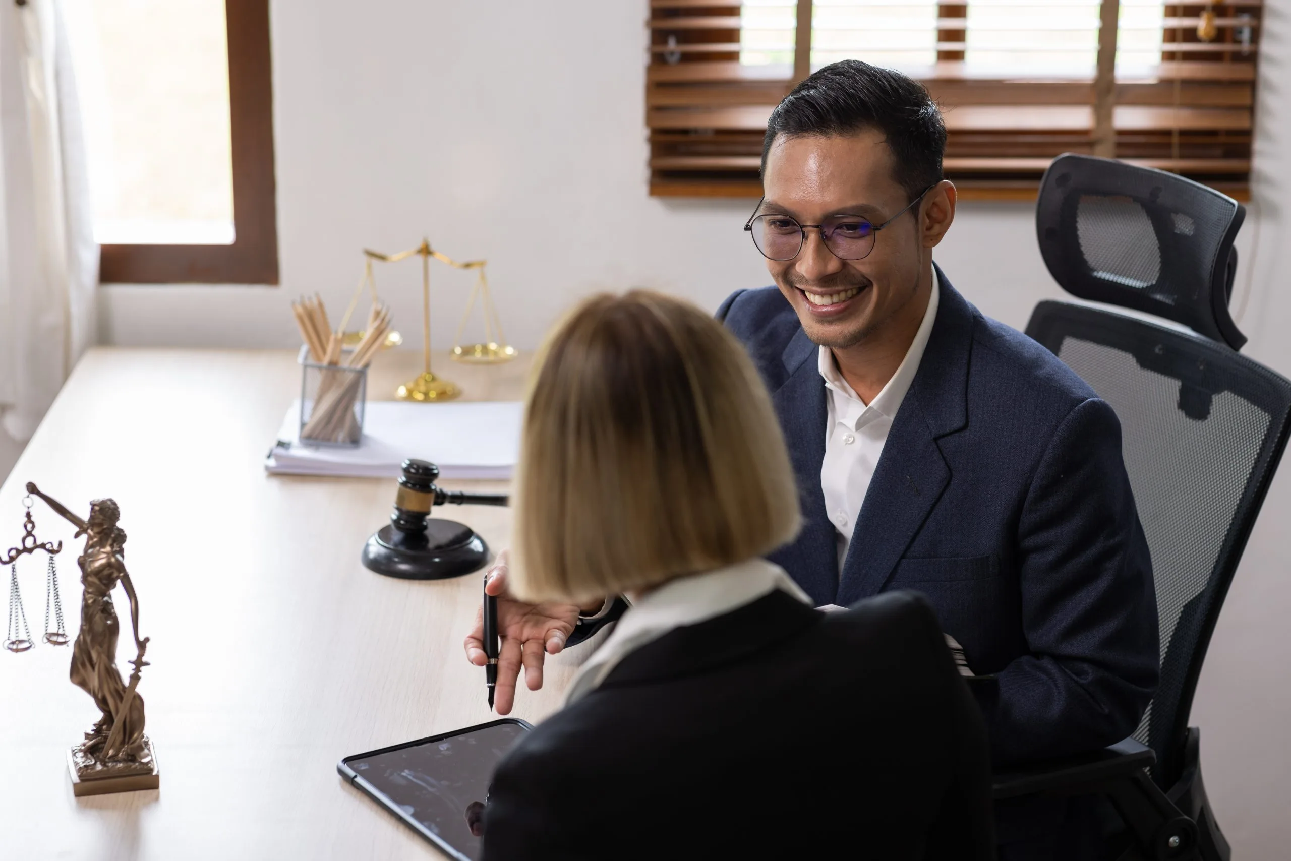 attorney-consults-with-client-in-modern-office-2026-03-19-02-13-26-utc
